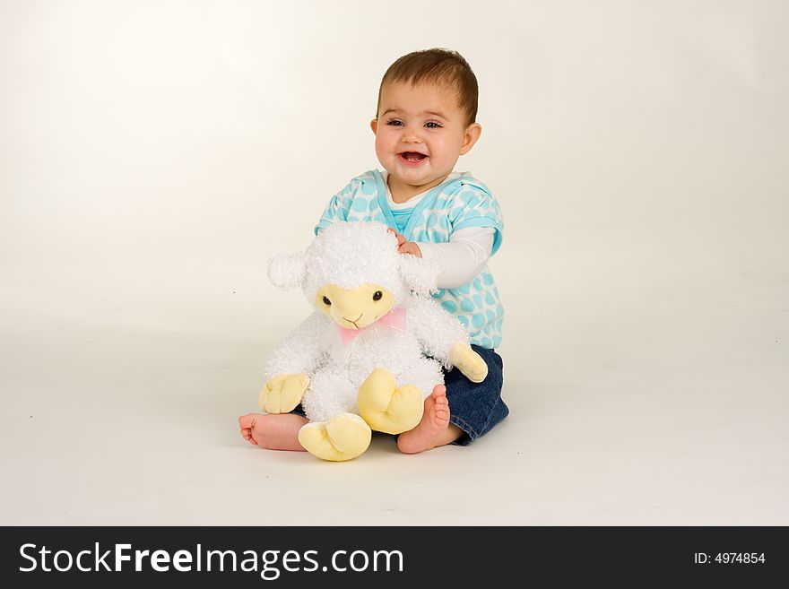 Baby with an Easter lamb - and is very happy. Baby with an Easter lamb - and is very happy