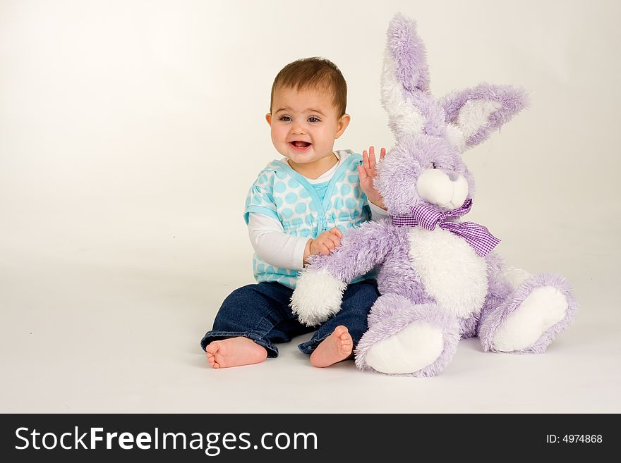 Baby with an Easter Bunny - and is very happy