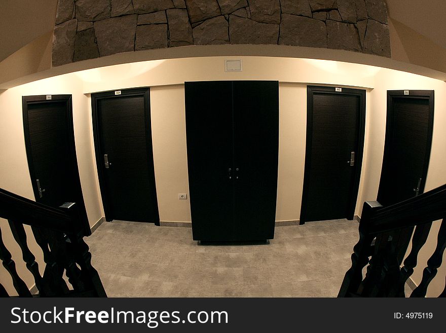 A dark and little room with many doors