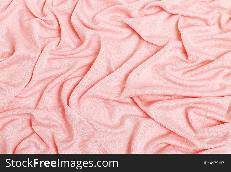 Pink textiles collected pleated, a background. Pink textiles collected pleated, a background