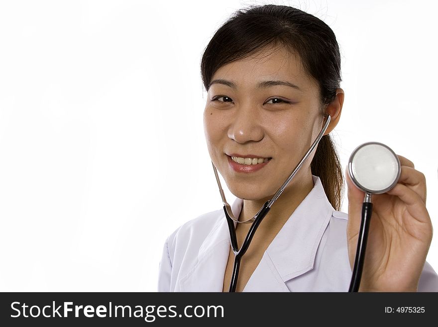 Female doctor holding a stethoscope in white background. Female doctor holding a stethoscope in white background.