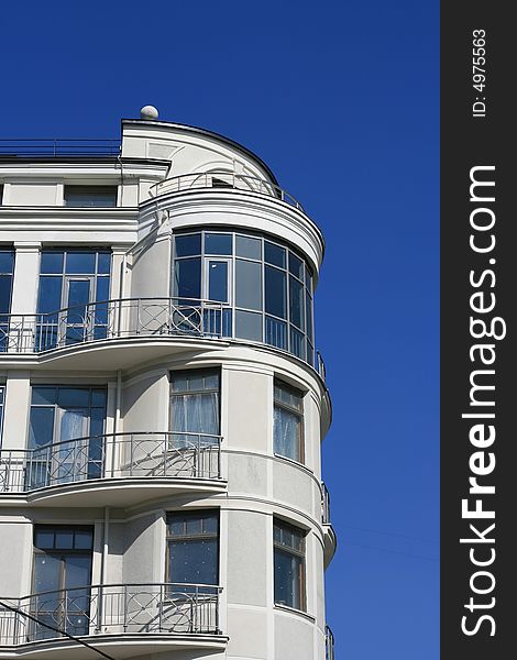 Modern a vein the house on a background of the dark blue sky. Modern a vein the house on a background of the dark blue sky