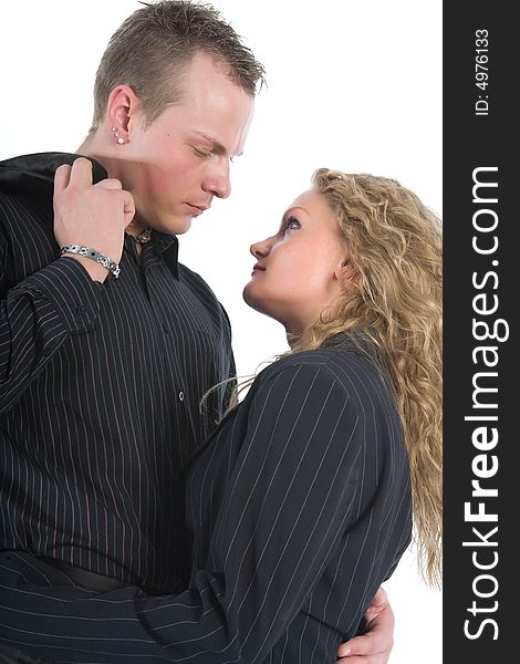 Young couple in black dress on white background