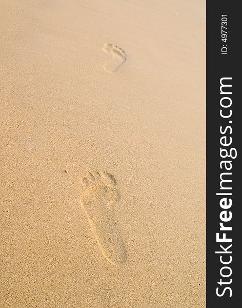 Two footprints at Patong beach, Phuket, Thailand