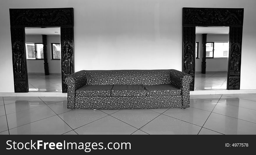 Sofa and mirrors in hall of hotel