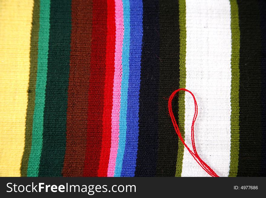 Colourful woven textile rainbow pattern