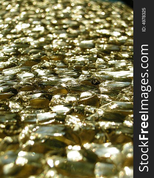 Shattered glass closeup with gold colour