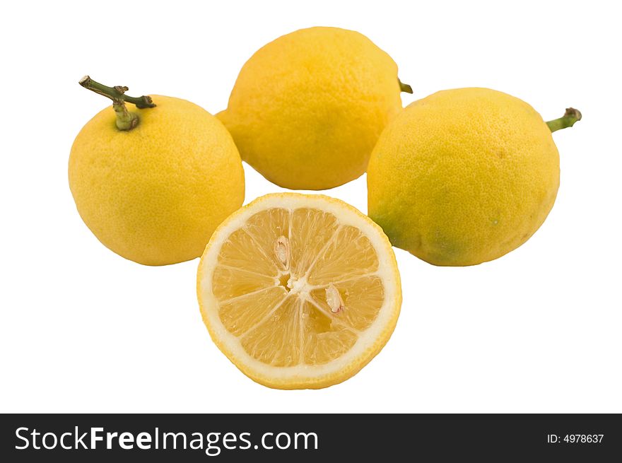 Three lemons and a half isolated on white