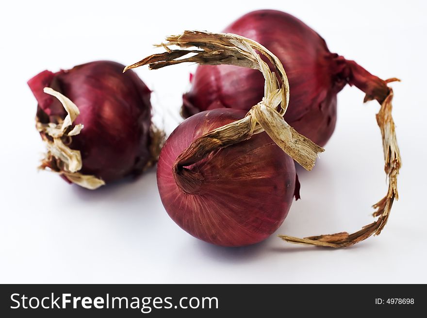 Three red onion isolated on white. Three red onion isolated on white