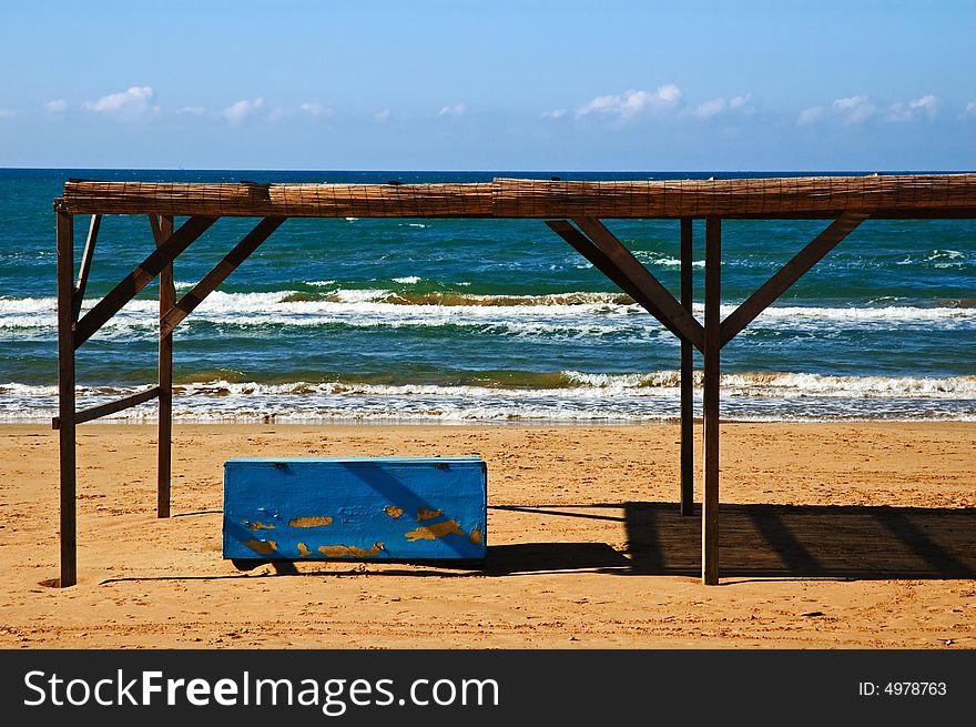 Abandoned blue box on beach