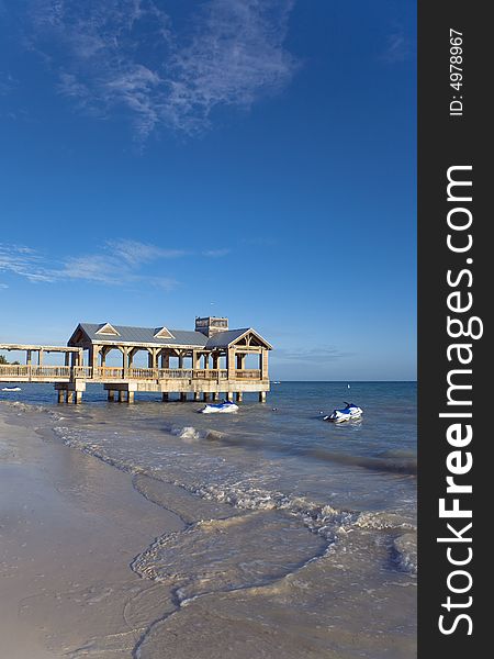 Pier with rental jet skis for tourists and vacationers in Key West, Florida. Pier with rental jet skis for tourists and vacationers in Key West, Florida.