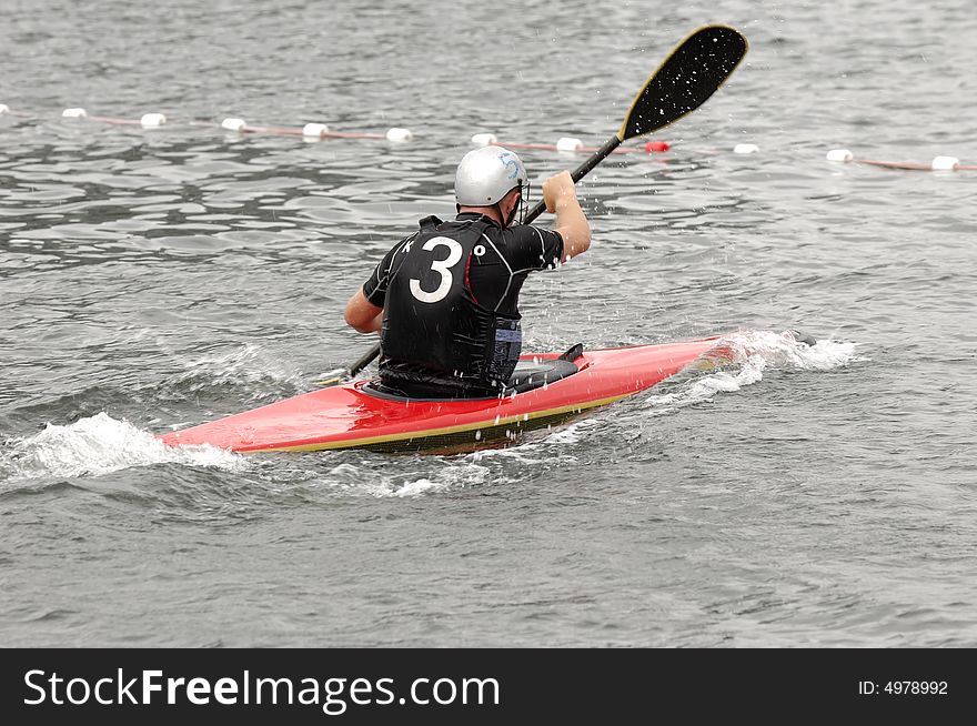 Man paddling in his kayak. Man paddling in his kayak