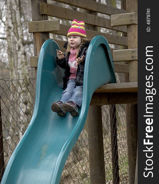 Happy girl on the slide. Happy girl on the slide