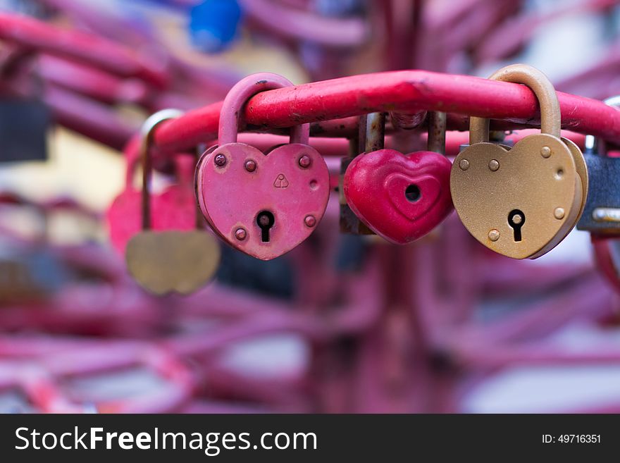 Old padlocks on blurred background, symbol of love