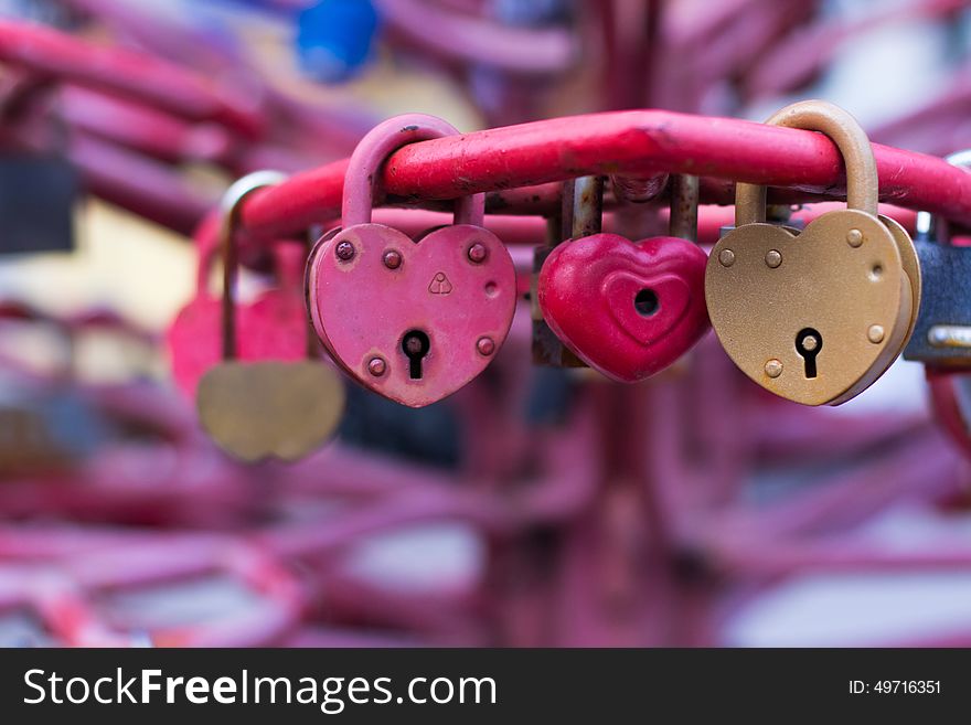 Old padlocks on blurred background