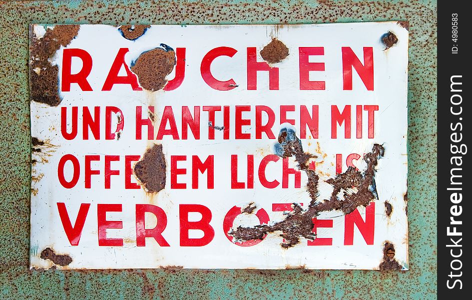 Grungy german no smoking metal sign (with a path to mask the background)