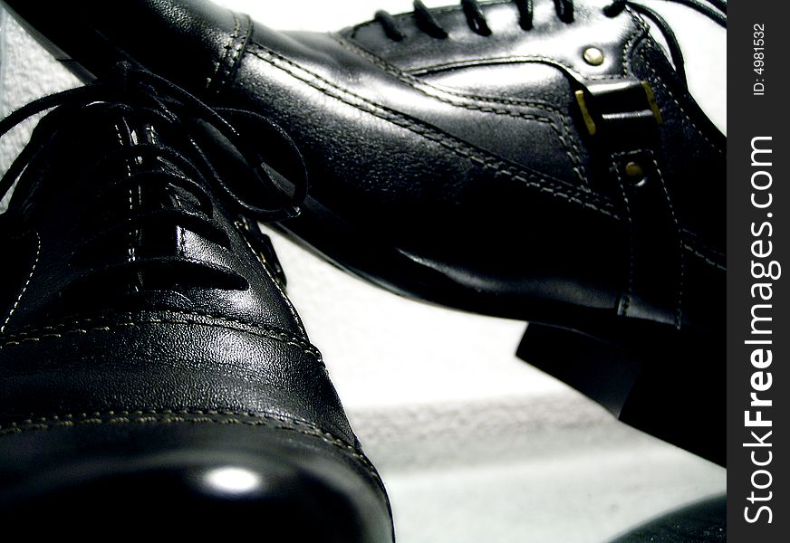 Advertising photo, man's black boots, studio, light the goods. Advertising photo, man's black boots, studio, light the goods.