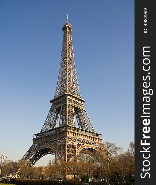 Eiffel Tower in Paris France with a bright blue sky. Eiffel Tower in Paris France with a bright blue sky