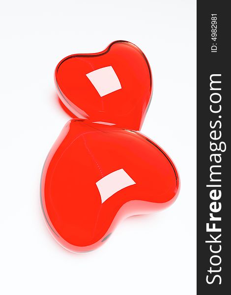 Two red glass hearts face to face. Two red glass hearts face to face
