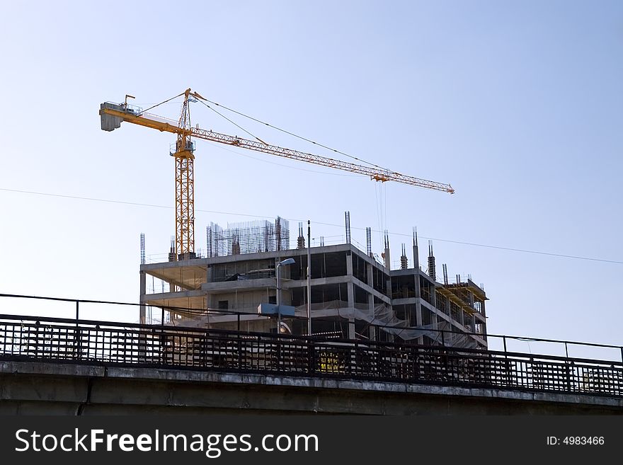 Crane working on a building site in city. Crane working on a building site in city