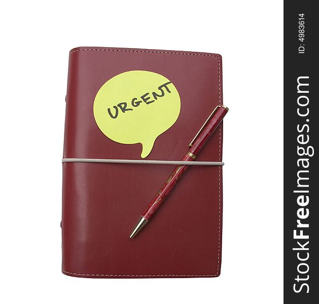 Red diary with an urgent note on top