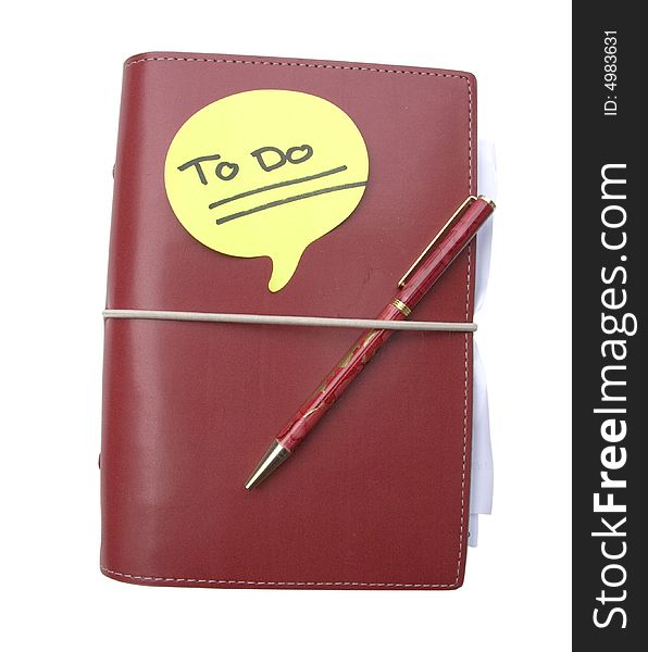 Red diary with an urgent note on top