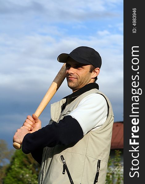 Man practicing baseball with baseball bat in hands. Man practicing baseball with baseball bat in hands.