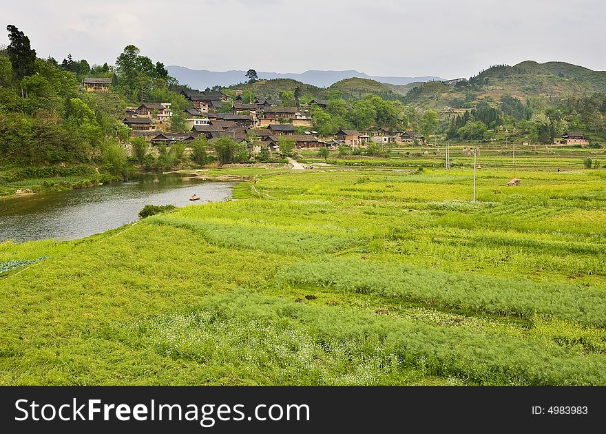 The village is in spring with the cole fields & thr river. The village is in spring with the cole fields & thr river