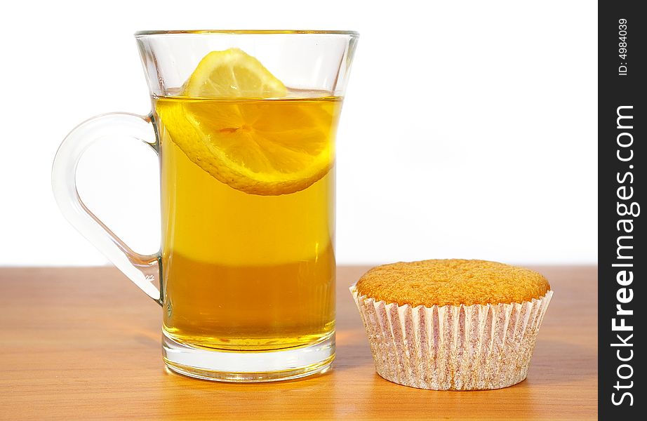 Cakes and the cup of tea on the  white background. Cakes and the cup of tea on the  white background