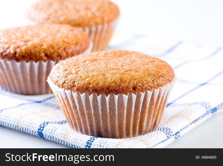 Three tasty muffins, isolated on white