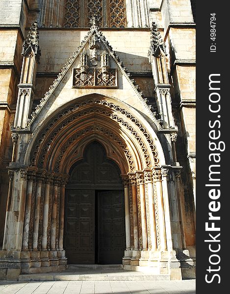 Portugal, Batalha:the famous batalha monastery was builted to commemorate the victory over the castilians in the battle of aljubarrota in 1385; the monastery belonged to the dominican; late gothic and manueline style intermingled in this architecture; the building was classified UNESCO world heritage site; the real name is monastery Santa Maria da Vitoria na Batalha; view of one of the doors. Portugal, Batalha:the famous batalha monastery was builted to commemorate the victory over the castilians in the battle of aljubarrota in 1385; the monastery belonged to the dominican; late gothic and manueline style intermingled in this architecture; the building was classified UNESCO world heritage site; the real name is monastery Santa Maria da Vitoria na Batalha; view of one of the doors