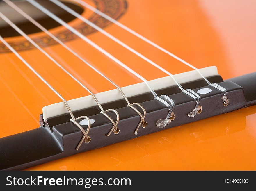 Acoustic Guitar Bridge And Strings Close-up