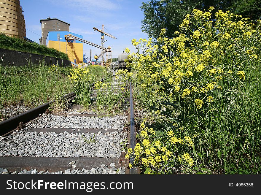 Industrial site with rail, in the spring photographed