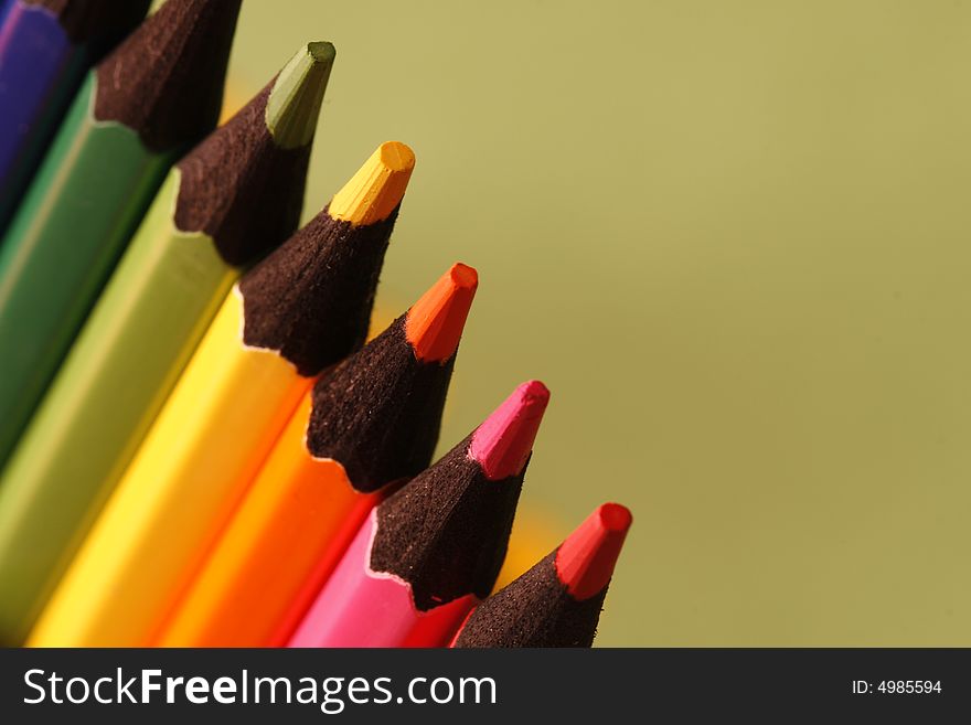 A part of pencils with a simple green background. A part of pencils with a simple green background