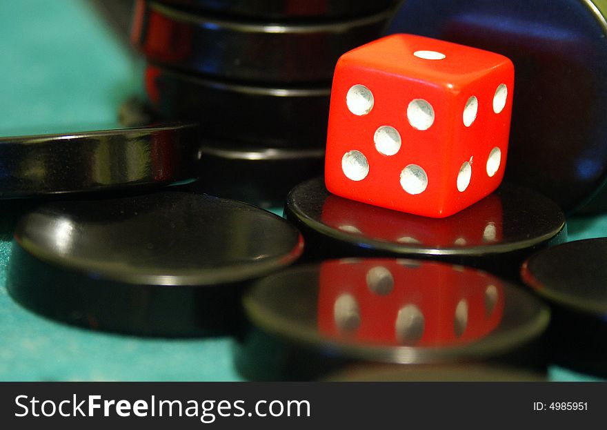 Red cube used to play backgammon. Red cube used to play backgammon