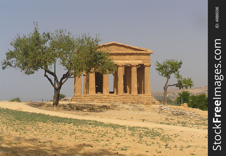 The ancient temple of concordia standing near the modern town of Agrigento