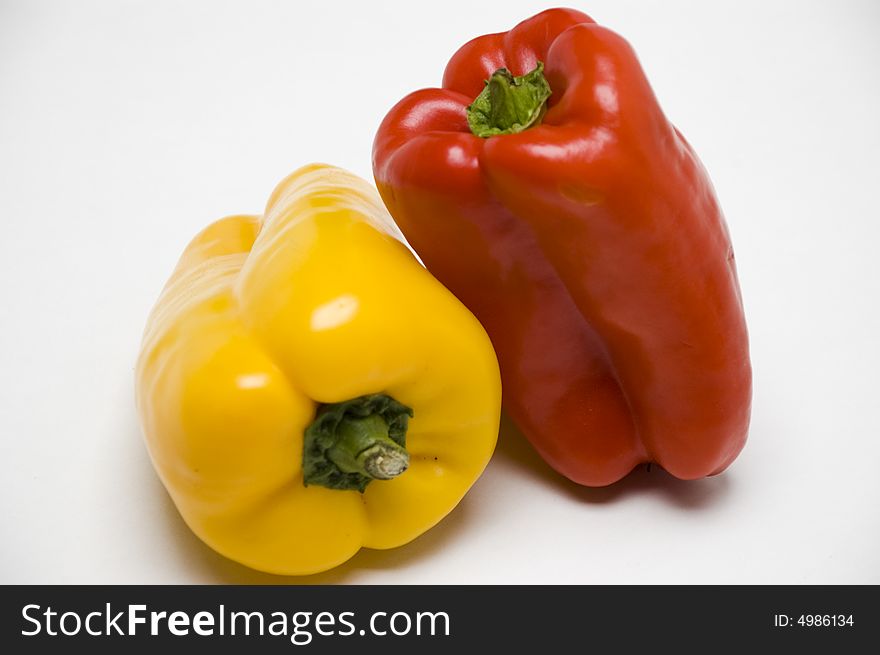 Yellow & red peppers inn white background. Yellow & red peppers inn white background