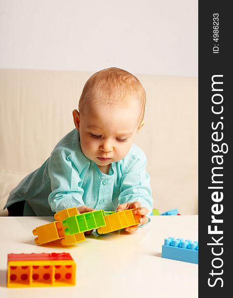 Portrait of young baby girl with toys. Portrait of young baby girl with toys