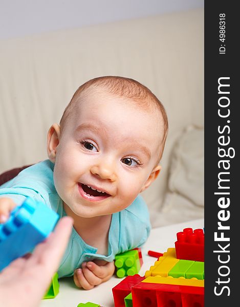 Portrait of  young baby girl with toys. Portrait of  young baby girl with toys