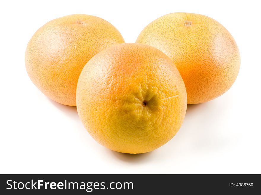 Fresh juicy grapefruit. Close up on a white background. Fresh juicy grapefruit. Close up on a white background.