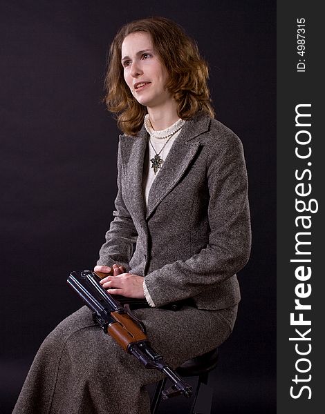 Businesswoman with submachine gun