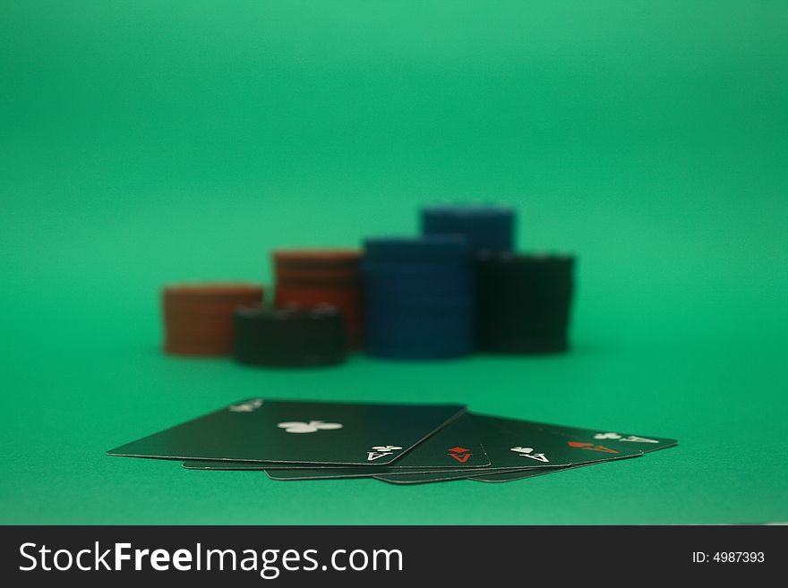 A great hand in a poker game with a green background. A great hand in a poker game with a green background.