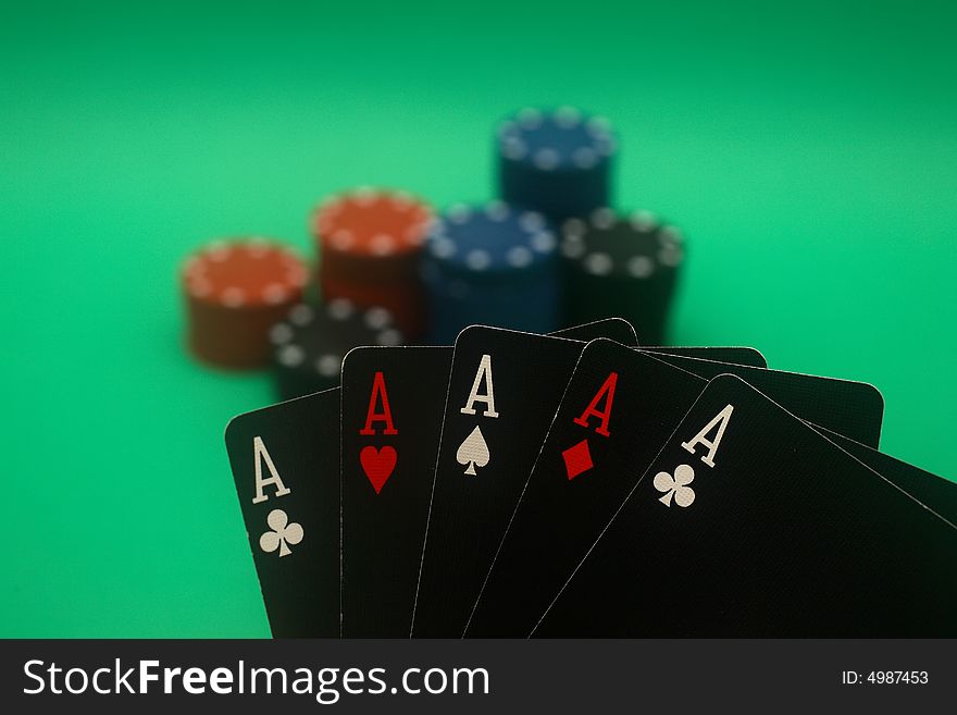 A great hand in a poker game with a green background. A great hand in a poker game with a green background.