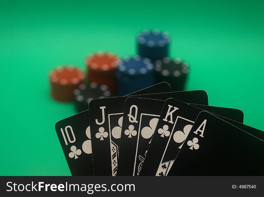 A great hand in a poker game with a green background. A great hand in a poker game with a green background.