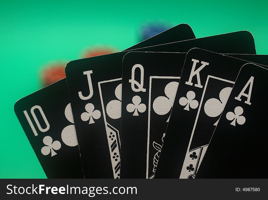 A great hand in a poker game with a green background. A great hand in a poker game with a green background.