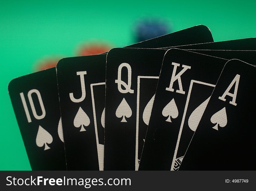 A great hand in a poker game with a green background. A great hand in a poker game with a green background.