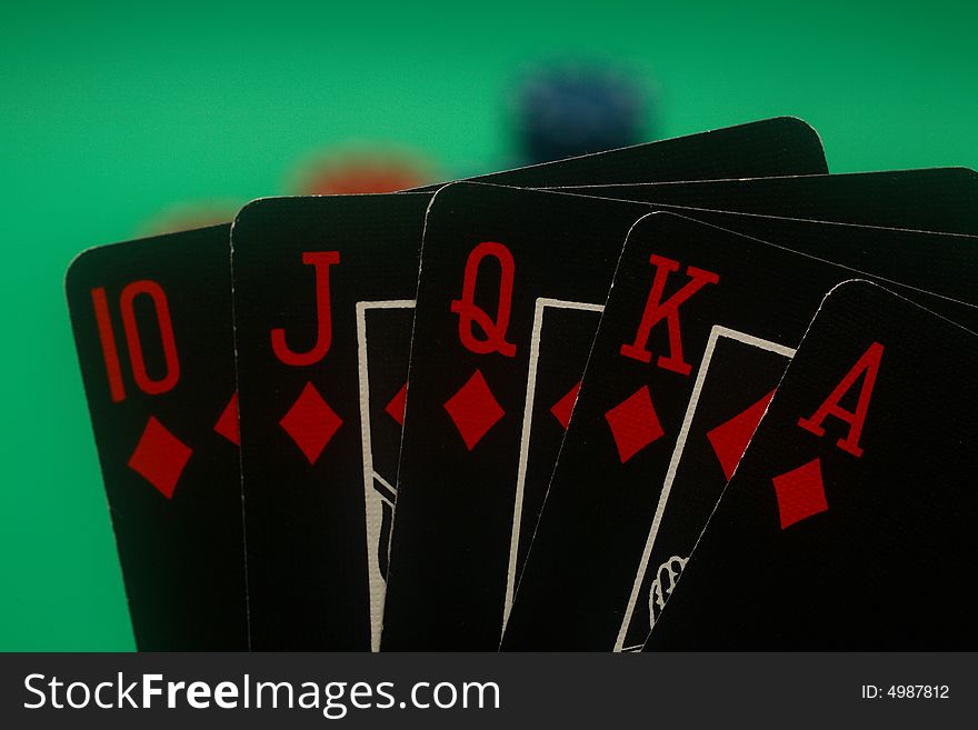 A great hand in a poker game with a green background. A great hand in a poker game with a green background.