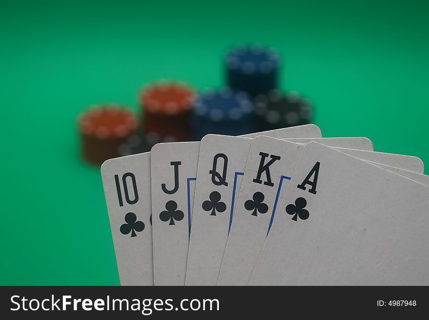 A great hand in a poker game with a green background. A great hand in a poker game with a green background.