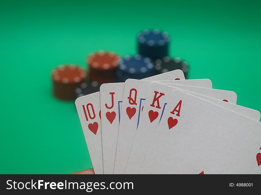 A great hand in a poker game with a green background. A great hand in a poker game with a green background.