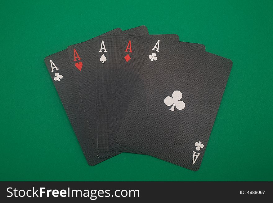 A great hand in a poker game with a green background. A great hand in a poker game with a green background.